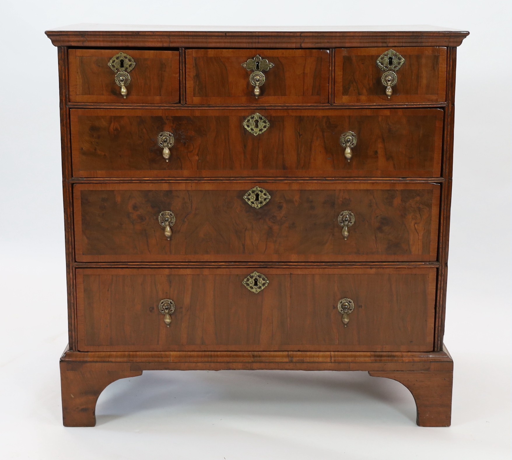 A George I crossbanded walnut chest, width 95cm depth 52cm height 96cm
